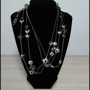 Long necklace with multicolor metal disc